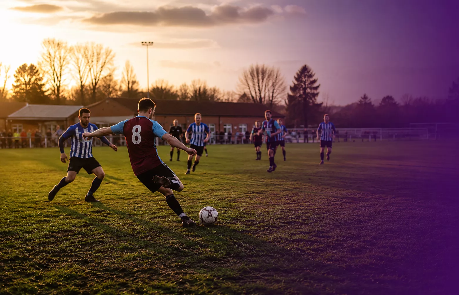 Grassroots football players on the pitch